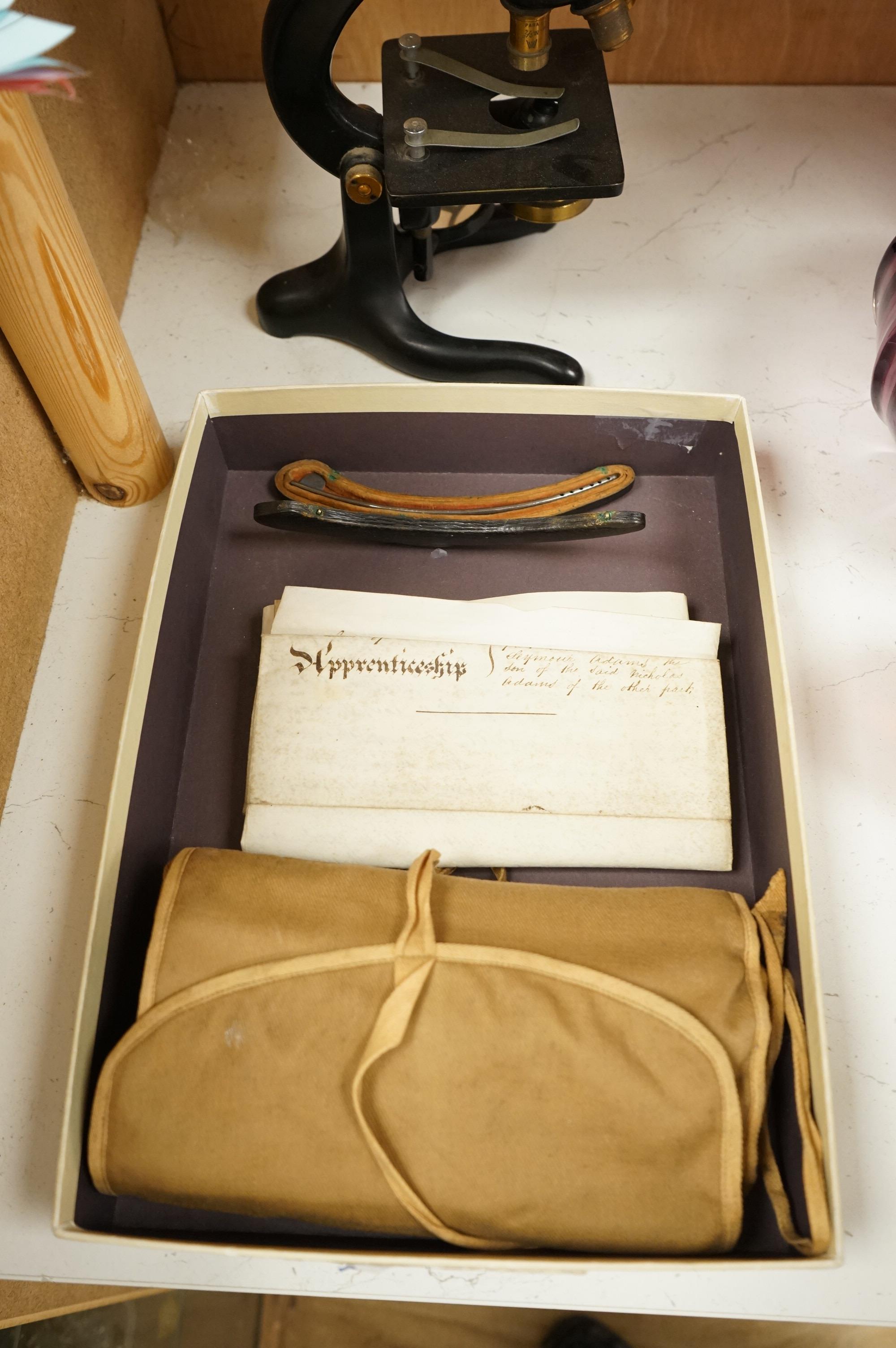 A parchment Indenture of Apprenticeship as a Surgeon and Apothecary between Nicholas Adams and Robert Seymour Adams of Hampshire, dated 1849, an early 20th century monocular brass microscope by W. Watson & Sons, 31cm hig
